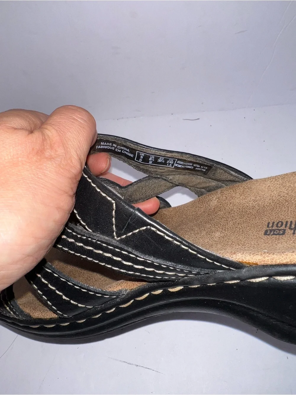 Clarks Women’s Black Leather Slip-On Sandals with Flower Accent